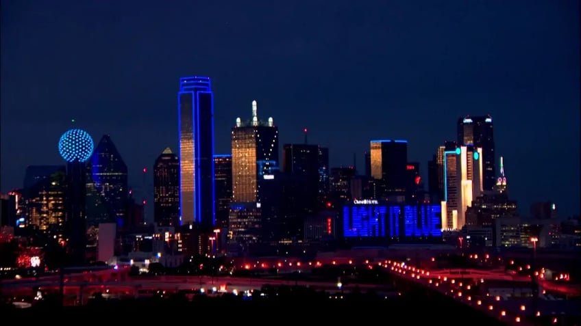 dallas buildings bathed in blue monday to bring awareness to child abuse