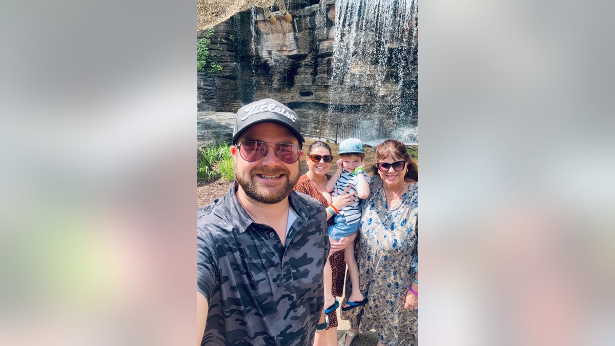 Amy Duggar's husband taking a selfie with his son, Amy Duggar King and his mother-in-law.
