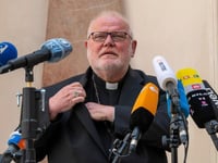 german cardinal resigns over church s failure in abuse scandal