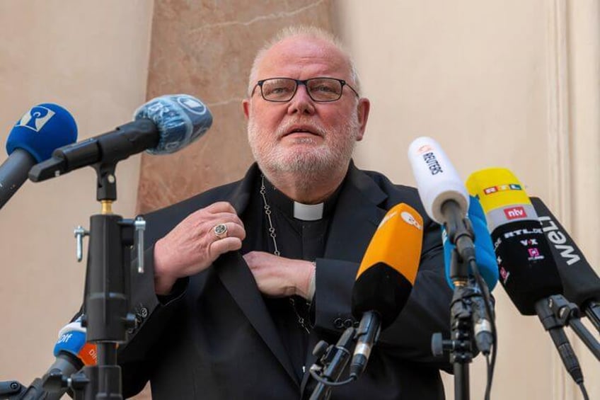 german cardinal resigns over church s failure in abuse scandal
