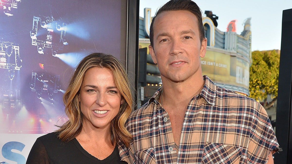 Hillsong church pastor Carl Lentz wears plaid shirt, wife Laura poses in black blouse