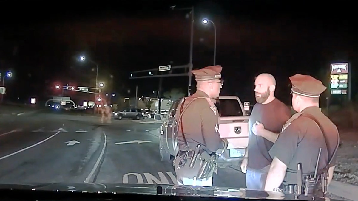 Jeremy Guthrie shown in dashcam still talking to police