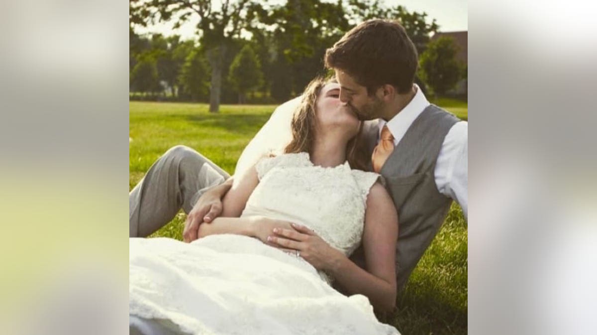 jill and derick kissing at their wedding