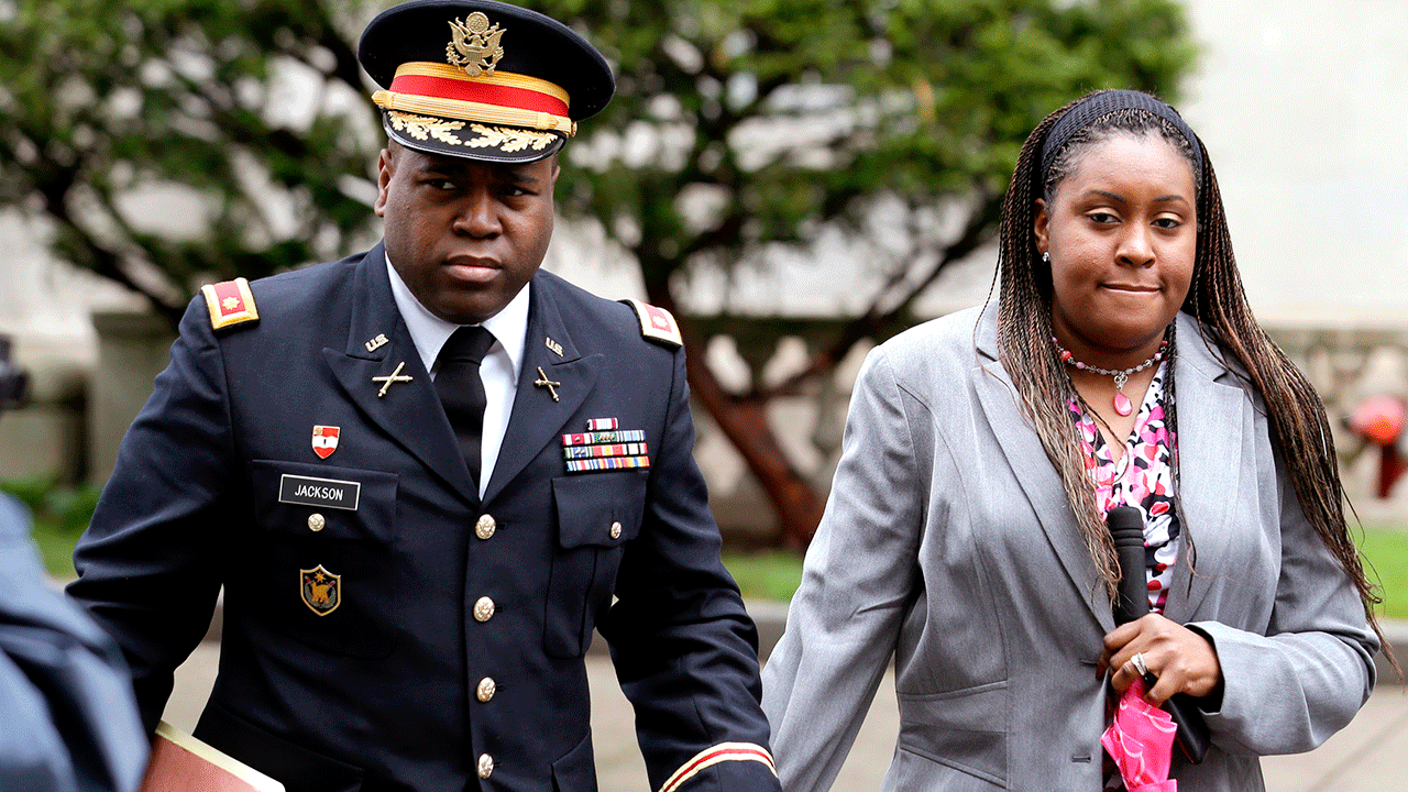 John Jackson and Carolyn Jackson walk out of New Jersey courthouse