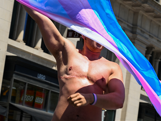 NEW YORK, NEW YORK - JUNE 26: A transgender athlete waves a Trans Pride Flag during the New York City Pride Parade on June 26, 2022 in New York City. Planned Parenthood was the first contingent of the parade this year following the Supreme Court overturning the 50-year-old landmark Roe v. Wade case ending the protection of federal abortions. The annual NYC Pride Parade returned fully in person this year after being scaled back in 2021 and cancelled in 2020 due to the COVID-19 pandemic. (Photo by Alexi Rosenfeld/Getty Images)