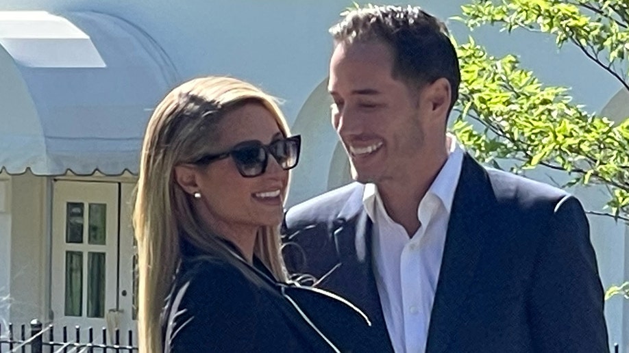 Paris Hilton and her husband Carter Reum arrive at the White House for a meeting on a child abuse law, Tuesday, May 10, 2022.