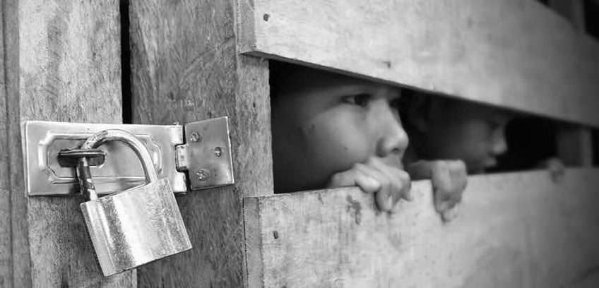 Trafficked children, locked in a wooden box
